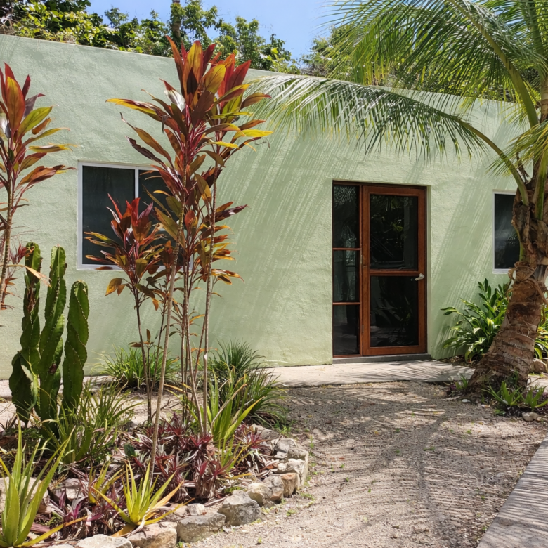 Hacienda Richardson for sale in Los Árboles Tulum, listed by Play-Investments.com. Sustainable mid-century home on 5 acres with solar system, guest house and potable water. USD 420,000.