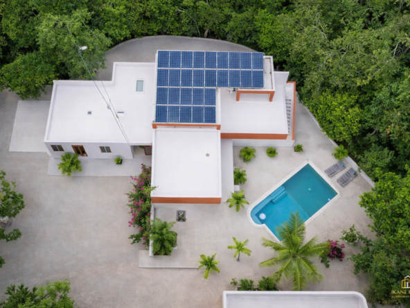 Hacienda Richardson for sale in Los Árboles Tulum, listed by Play-Investments.com. Sustainable mid-century home on 5 acres with solar system, guest house and potable water. USD 420,000.