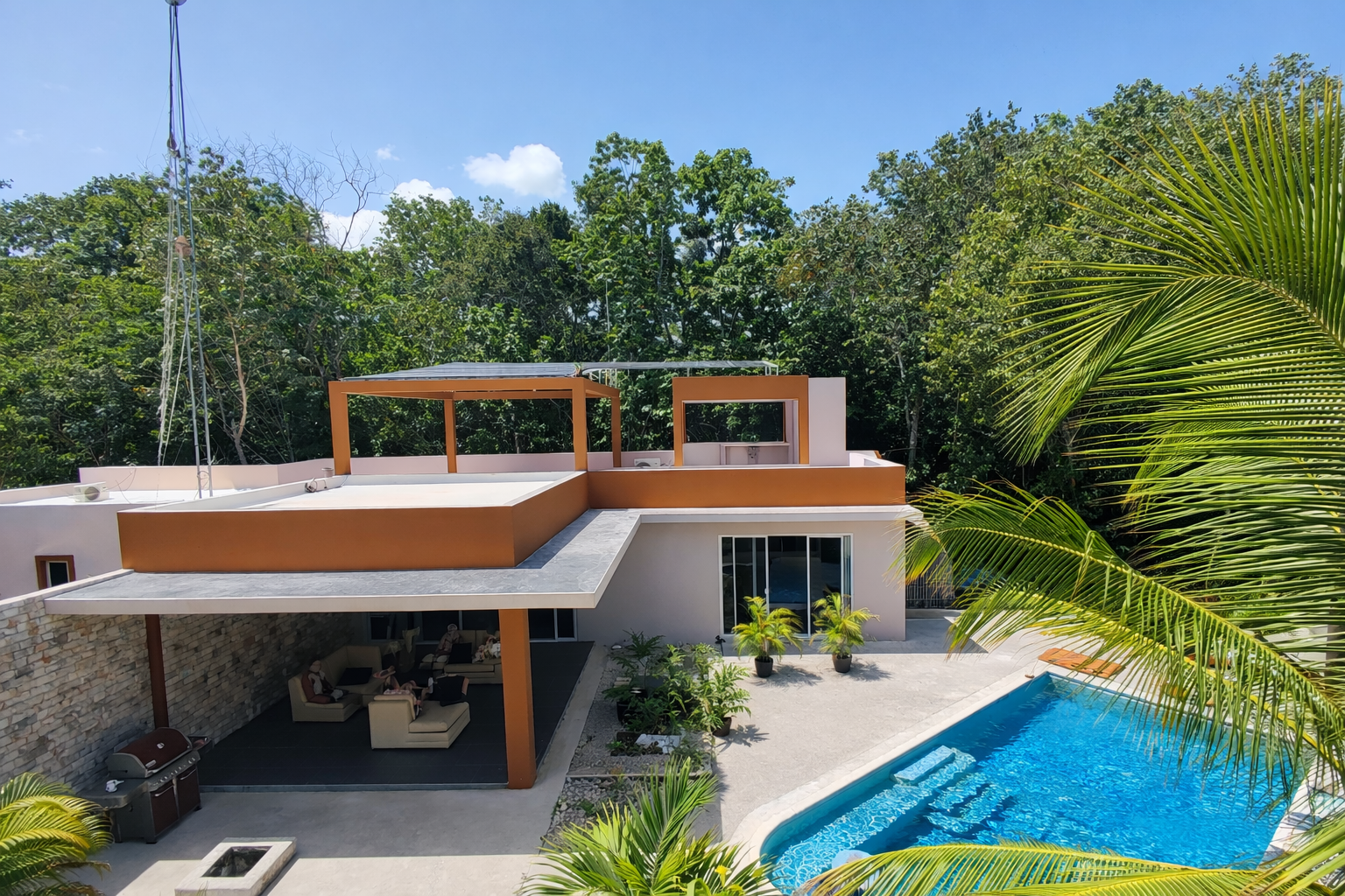 Hacienda Richardson for sale in Los Árboles Tulum, listed by Play-Investments.com. Sustainable mid-century home on 5 acres with solar system, guest house and potable water. USD 420,000.